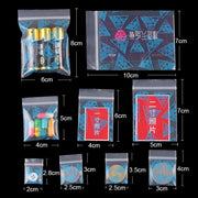 StoBag 100pcs Cartoon Transparent Mini Zipper Plastic Bags Small Sealing Jewelry Packaging Pouch Storage Waterproof Reusable